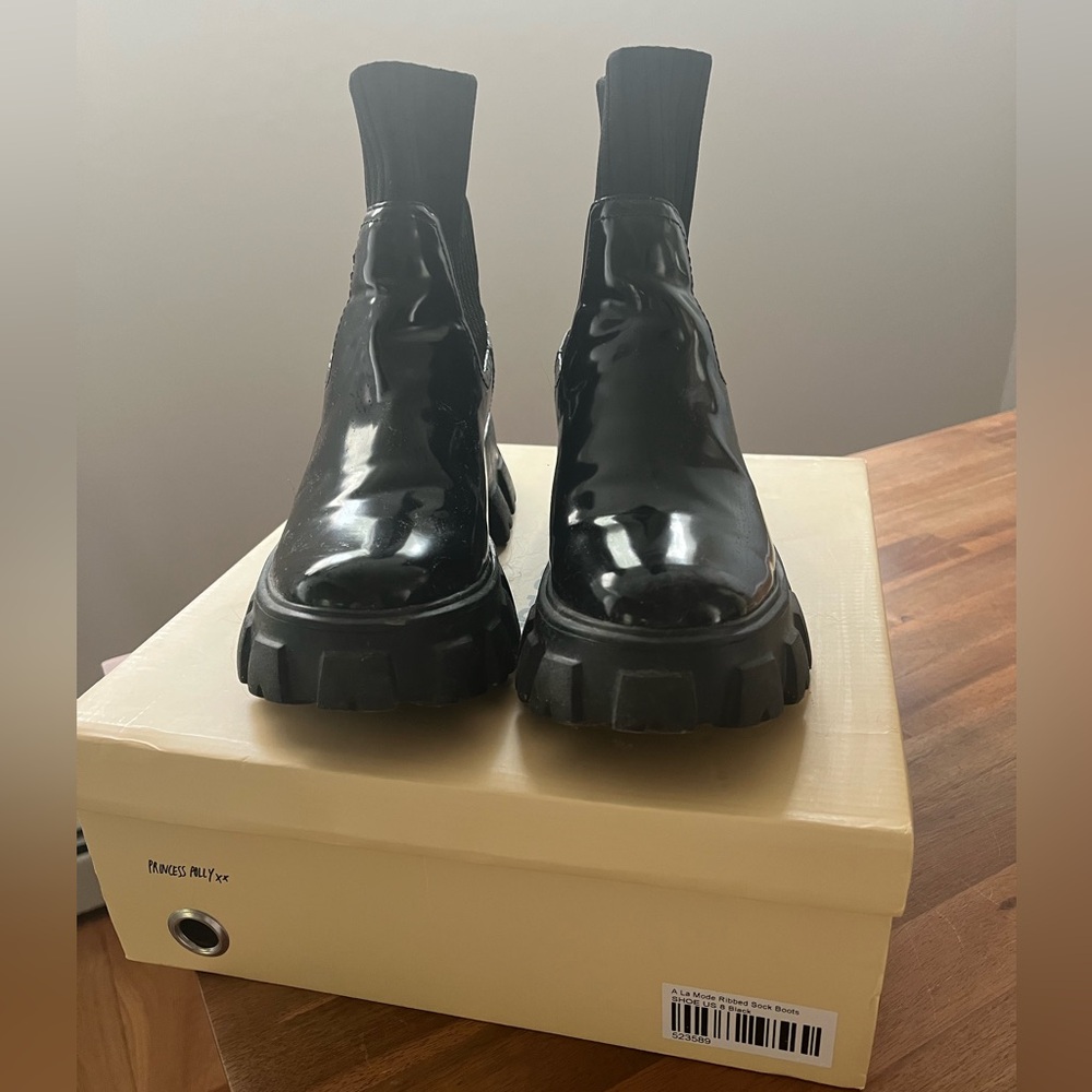 Ribbed patent leather sock boots.